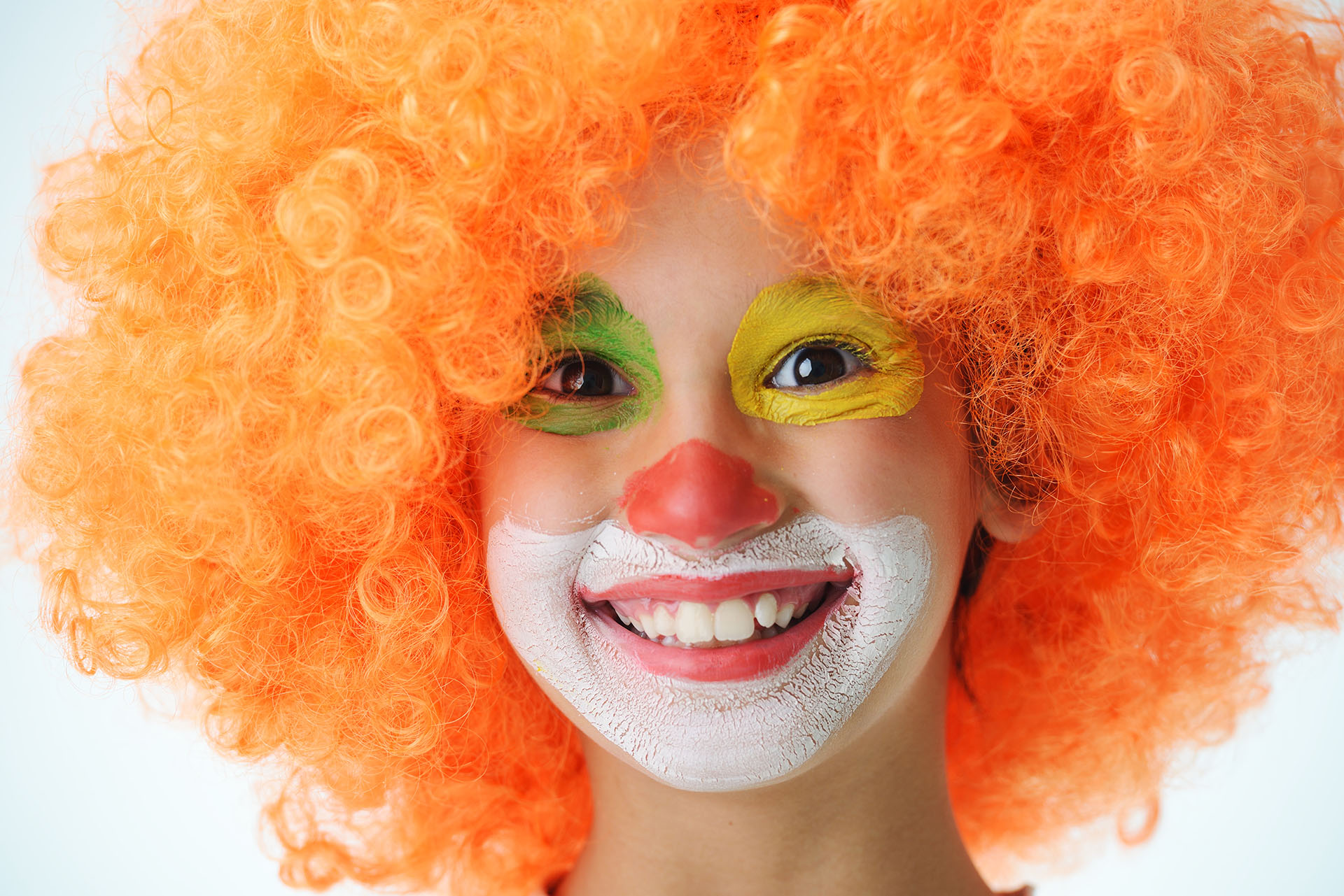 Portrait of happy funny clown kid